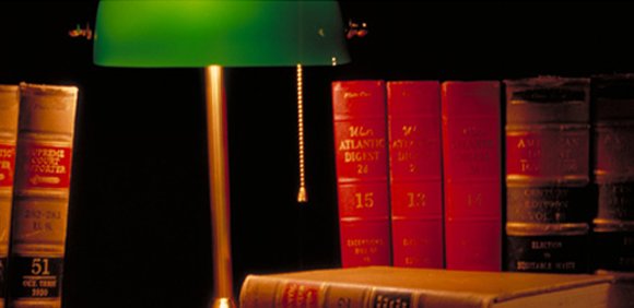 law books and a lamp